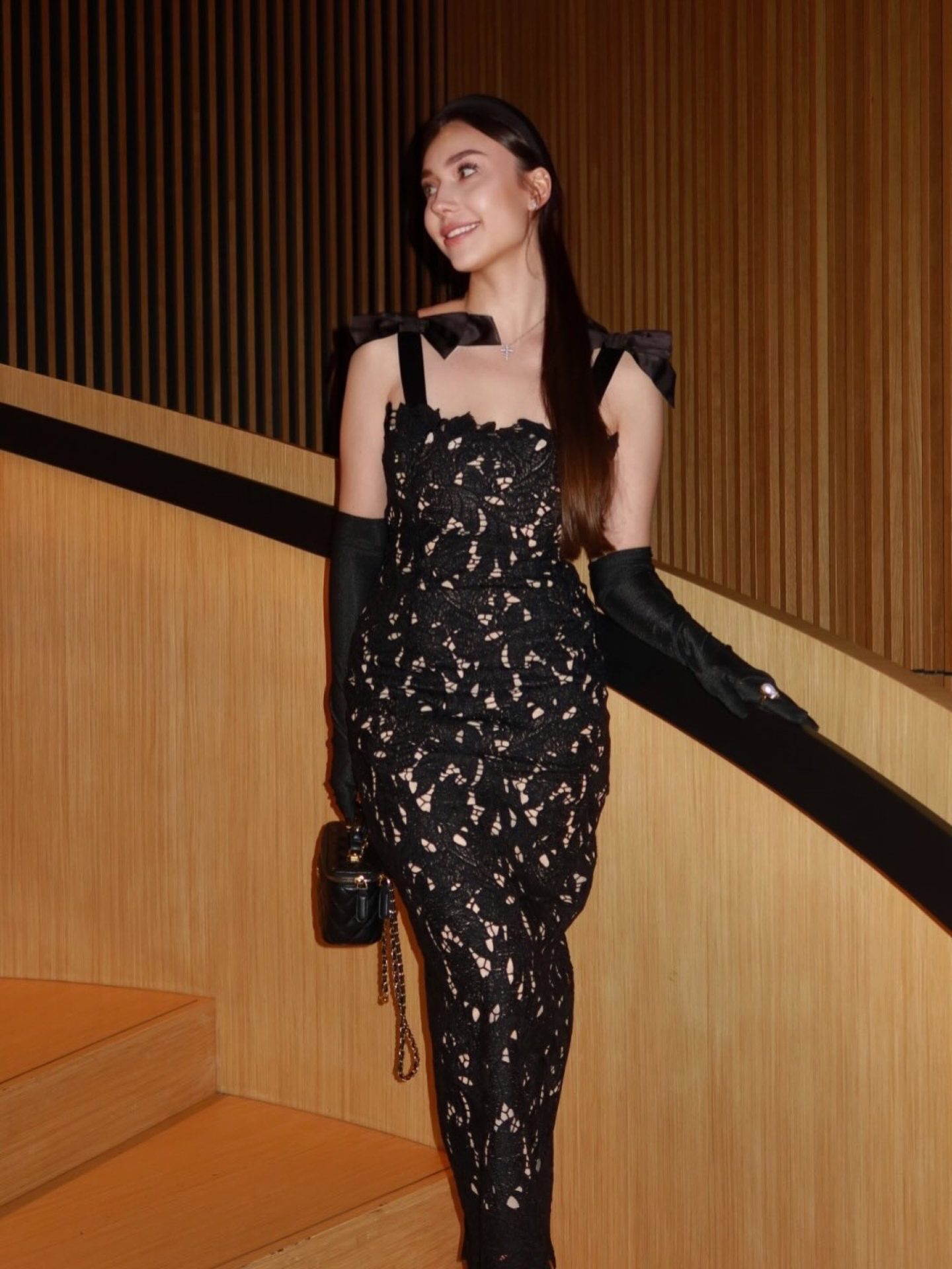 Bella Barnett — black lace dress with opera gloves, frame 1