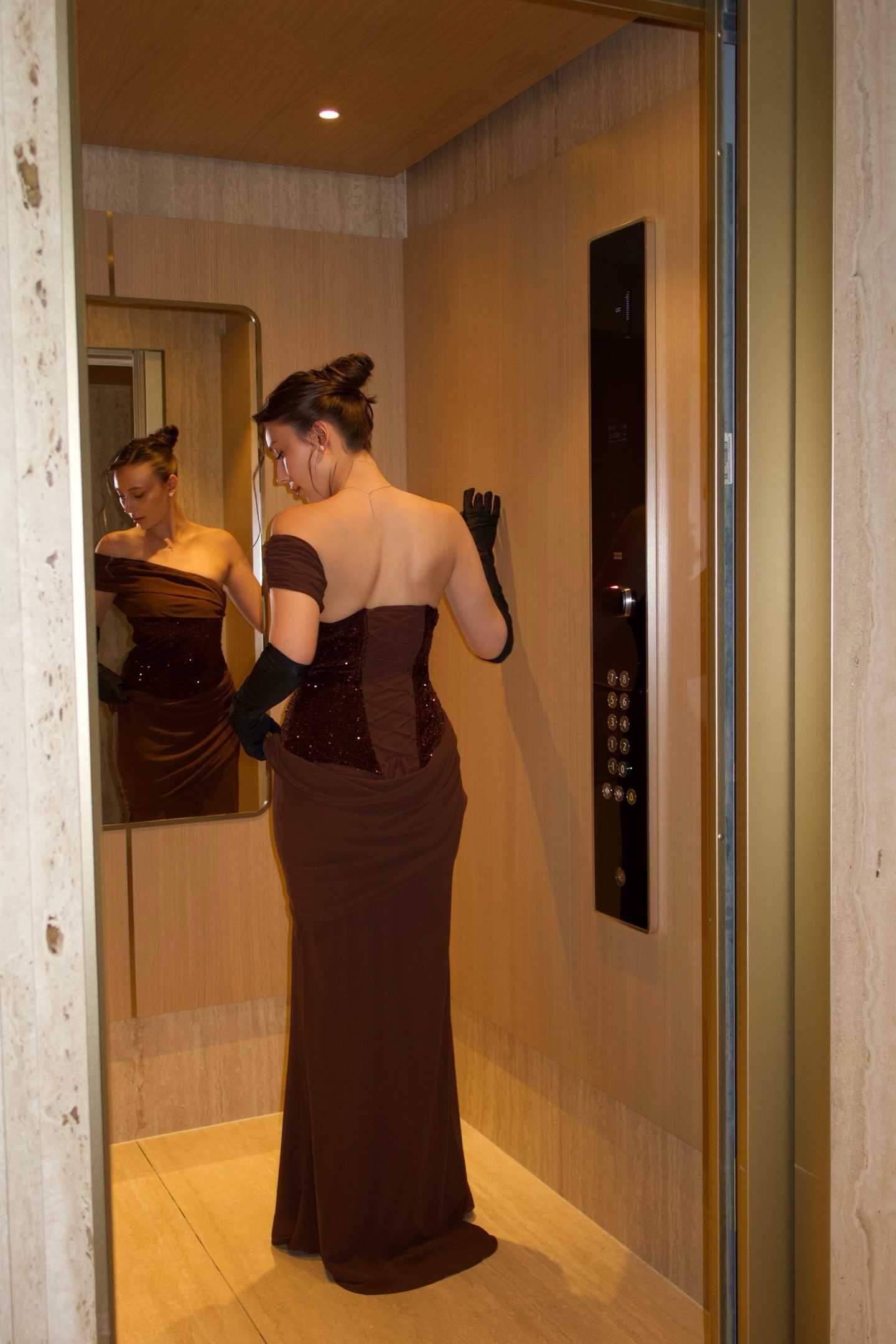 Bella Barnett — brown corset gown, frame 2