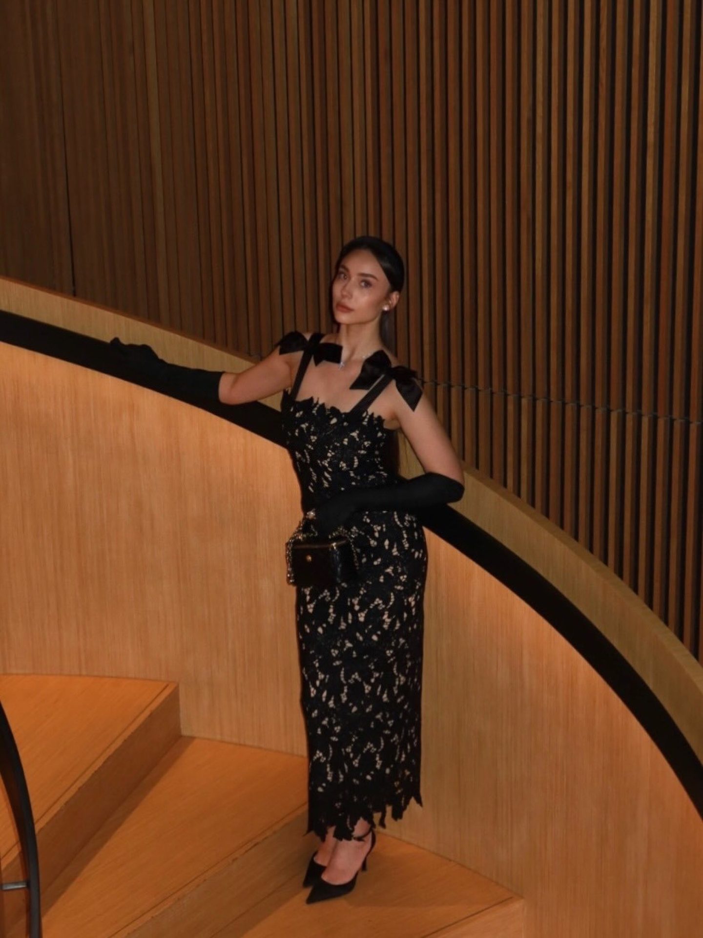 Bella Barnett — black lace dress with opera gloves, frame 2